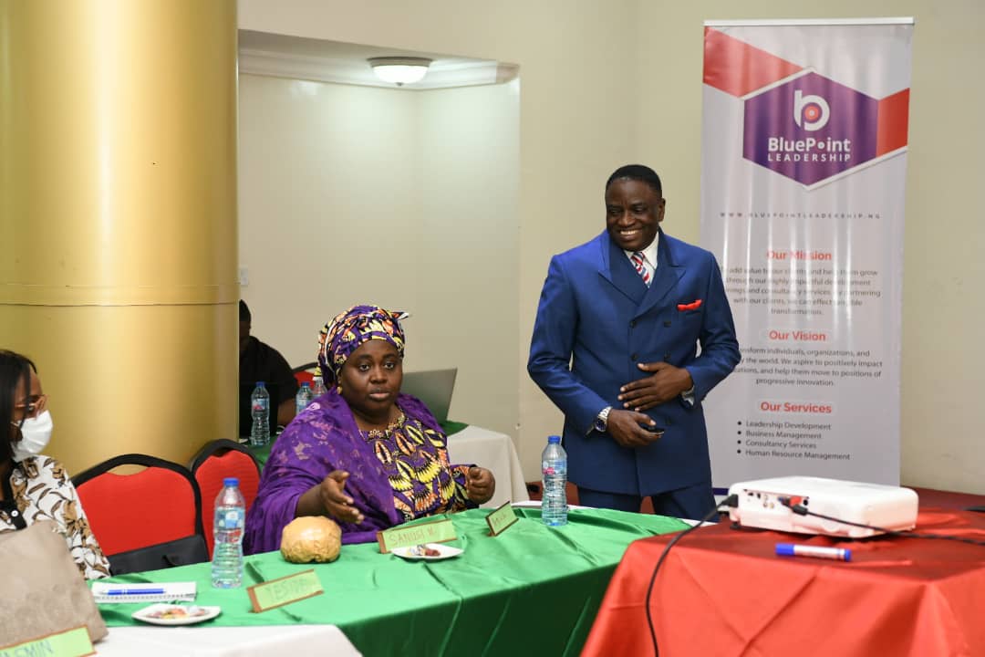 Pat Akem-Vingir speaking with an attendee